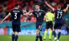 Scotland's Andrew Robertson (left) and Kieran Tierney react after the UEFA Euro 2020 Group D match at Wembley.
