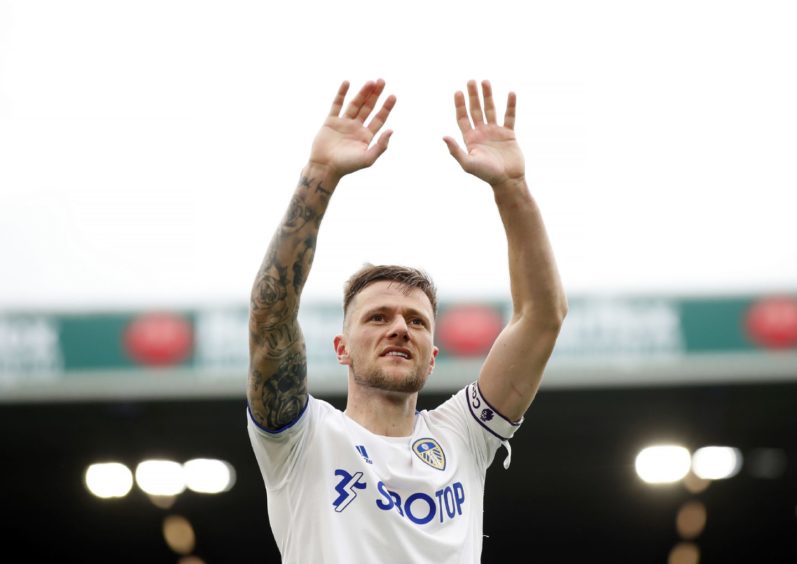 Leeds United's Liam Cooper applauds the fans after the final whistle during the final Premier League match at Elland Road.