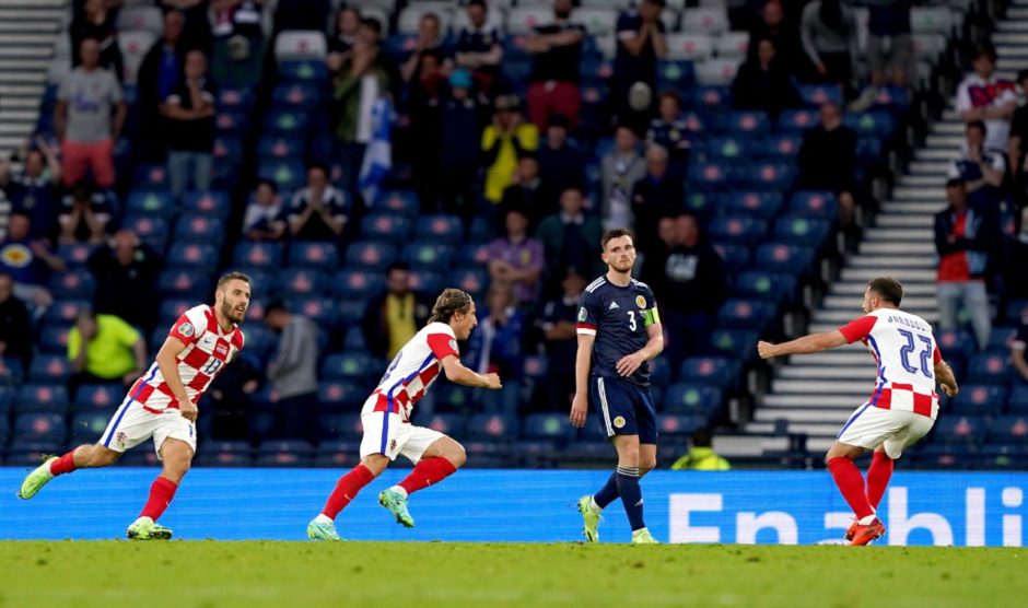 Croatia's Luka Modric (centre) celebrates scoring their side's second goal against Scotland.