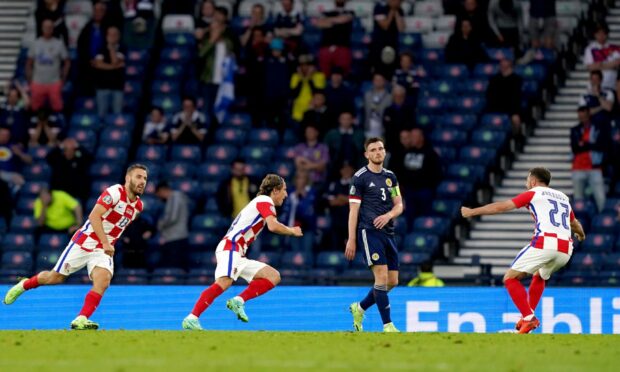 Croatia's Luka Modric (centre) celebrates scoring their side's second goal against Scotland.