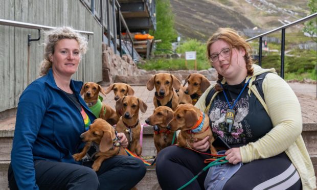 Jessica Probst and Isla Gray with their Dachshund dogs.