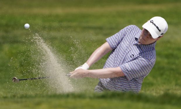 Robert MacIntyre plays a shot from a bunker on the first hole during the first round of the US Open.