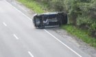 Overturned car on A96.
