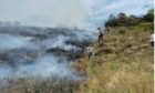 Outdoor survival instructor Leon Durbin has apologised after a bonfire in his garden sparked a wildfire at the Sound of Arisaig last week.