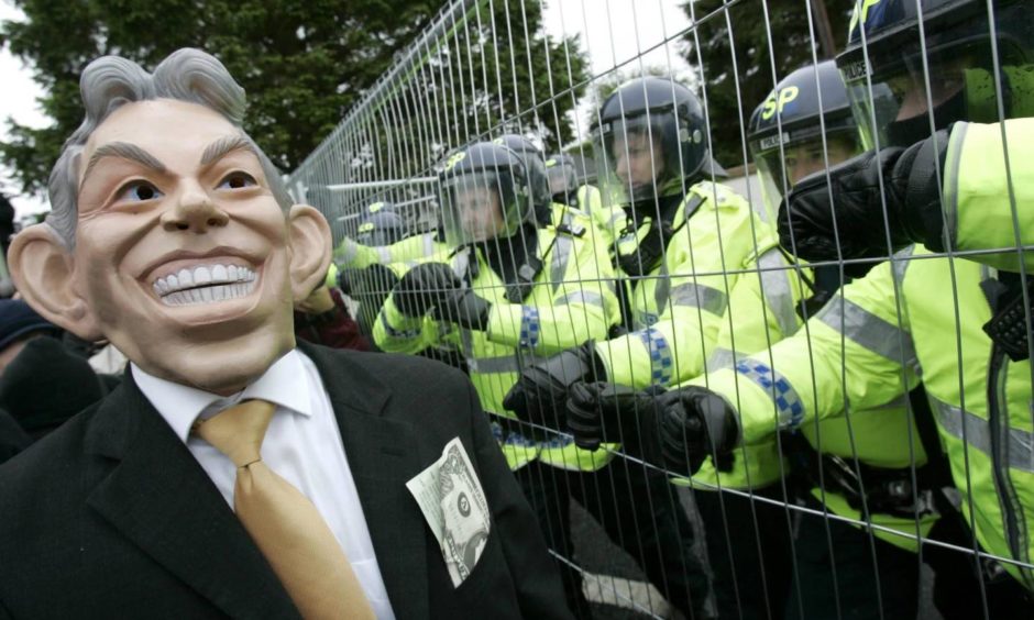 Protesters clash with riot police on the outskirts of Gleneagles Hotel at the G8 Summit in 2005.