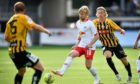 RB Leipzig's Emil Forsberg (C) is chased by Hacken's Gustav Berggren (R) - who is still at the club - during a UEFA Europa League second round qualifier in 2018.