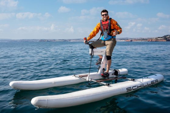 Pedal4Parks founder Isaac Kenyon on a water bike, which the team used to cross the Pentland Firth