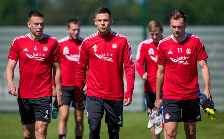 Christian Ramirez with Andy Considine, left, and Ryan Hedges, right.