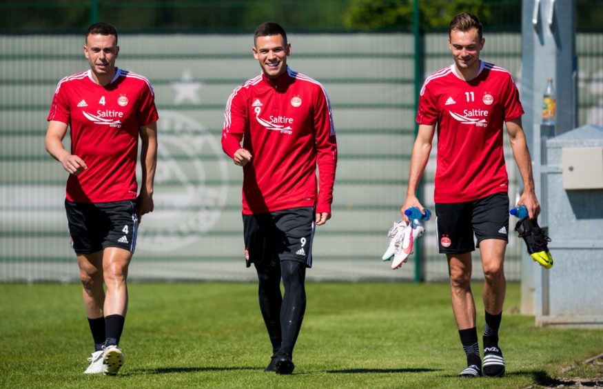 Christian Ramirez with Andy Considine, left, and Ryan Hedges, right.