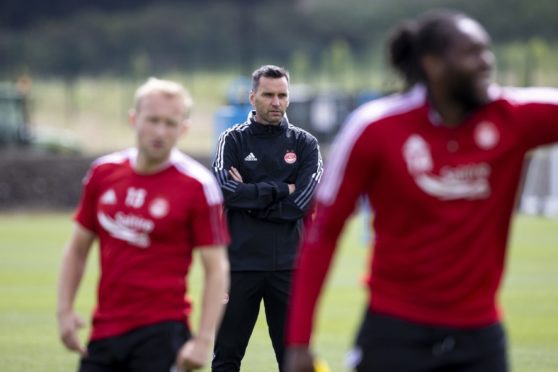 Aberdeen manager Stephen Glass oversees training at Cormack Park ahead of the new season.