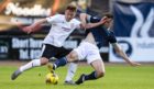 Brora's Andrew Macrae, left, tries to get the better of Dundee's Cammy Kerr