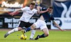Brora's Andrew Macrae, left, tries to get the better of Dundee's Cammy Kerr