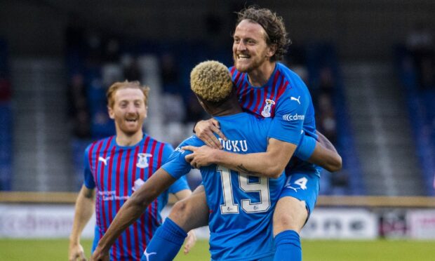 Manny Duku celebrates his goal with provider, Tom Walsh.