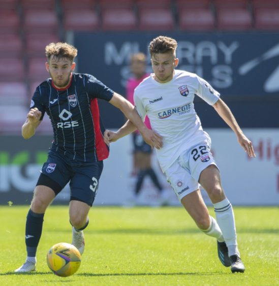 Jake Vokins, left, in action on the football pitch for Ross County against Montrose.