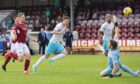 Shane Sutherland clips the ball over Arbroath keeper Derek Gaston to seal a 1-0 Inverness win.