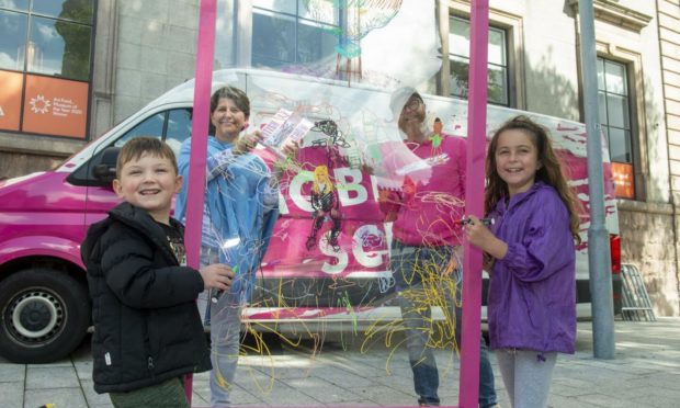 Aberdeen City Council’s culture spokeswoman Councillor Marie Boulton with Craig Barrowman, Mobile Art School co-ordinator, and two budding artists.