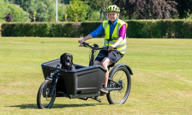 Outfit Moray instructor Anna Bailey with dog Dixon at Elgin Bike Fest. Photo: Jasperimage