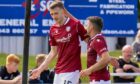 Arbroath match-winner Luke Donnelly celebrates his 80th minute clincher at Elgin with Dale Hilson.
