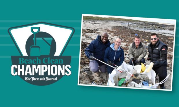 (L to R) Jacob Opata, Martin O’Donnell, Paul Williams and Lee Gilmour from Premier Oil filling a rubbish collection bag.