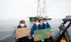 Holly Gillibrand from Fort William staged a protest at Beatrice offshore wind farm in the North sea on Wednesday alongside fellow campaigners Lily Henderson and Dylan Hamilton.