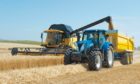 IN ACTION: Preparations for grain harvests should also include ensuring tractors and trailers are set to operate safely and efficiently.