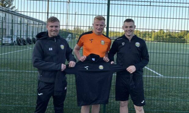 Defender Louis Kane checks in after signing a one-year deal at Fort William. He is pictured with manager Ashley Hollyer, left, and coach Paul Coutts.