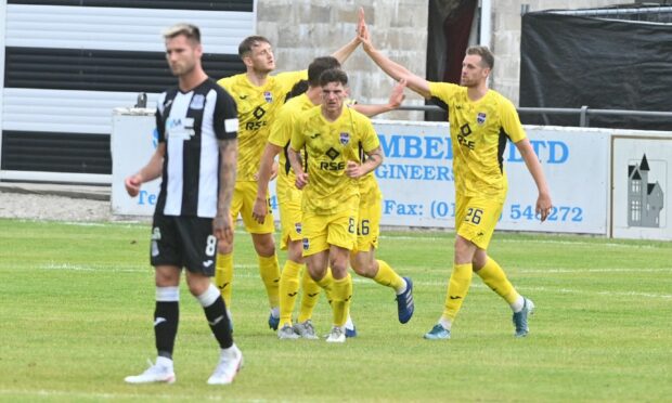 Ross County striker Jordan White, right, celebrates after getting on the scoresheet. Picture by Jason Hedges