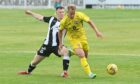 Harry Paton, right, goes on the run against Elgin City. Picture by Jason Hedges
