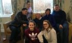 John Angus surrounded by his family inside the Home Farm care home on Skye.