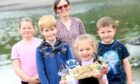 The winners of the Beach Clean Champions series and the Really Rubbish Trophy, the children of Catterline Primary.
 Teacher Jane Turner with L-R Catterline Primary pupils Ellie, Nicholas, Katie and Murray with the trophy.   
Picture by Kami Thomson