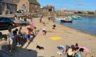 Sunbathers enjoy 26C heat in Stonehaven as the weekend got off to a great start.