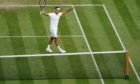 Roger Federer celebrates match point in the second round men's singles match against Richard Gasquet.