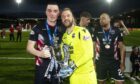 Ross County's Sean Kelly (left) and Scott Fox celebrate with the 2018/19 Championship trophy