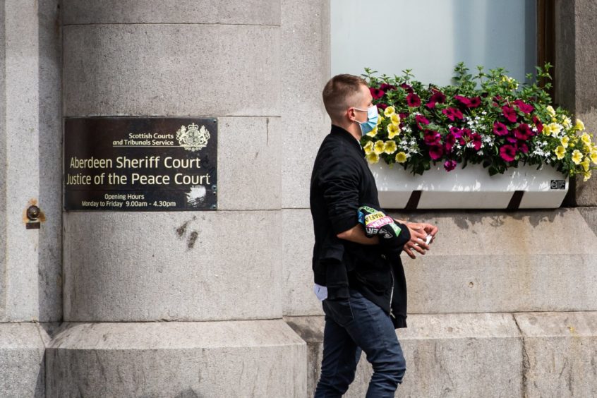 The accused, Patryk Pogodzinski, leaving Aberdeen Sheriff Court after a previous appearance