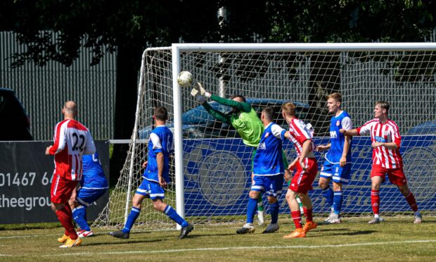 Maud goalkeeper Joe Barbour saves at the front post against Colony Park.