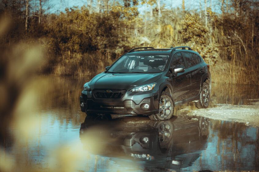 Subaru driving through water