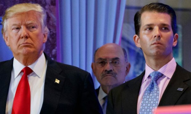 Donald Trump, left, his chief financial officer Allen Weisselberg, center, and his son Donald Trump Jr.