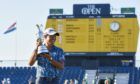 Collin Morikawa holds the Claret Jug after winning the 149th Open Championship at Royal St George's.