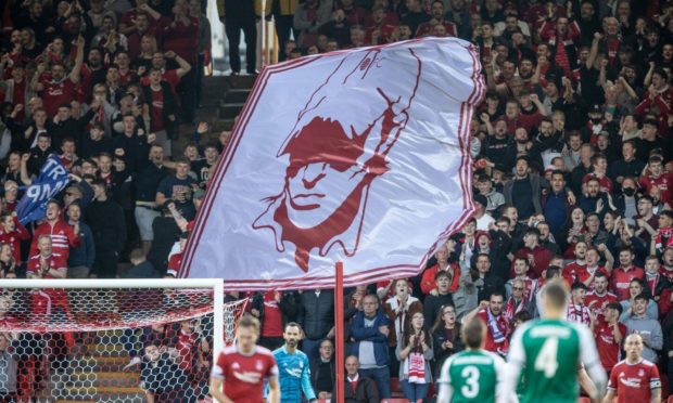 Aberdeen fans in the Red Shed during the Europa Conference League match between Aberdeen and Breidablik. Picture by Stephen Dobson