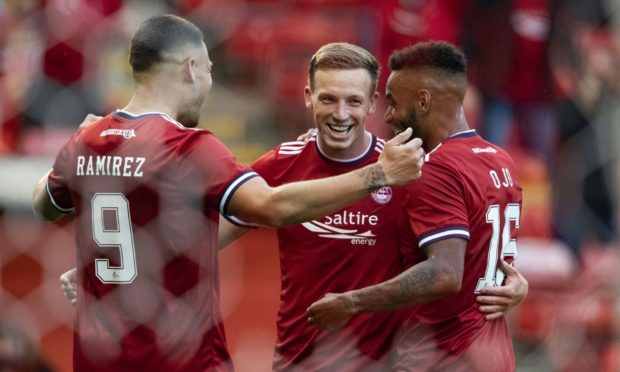 Celebration time. Aberdeen's Lewis Ferguson (centre) celebrates his second goal against BK Hacken in the Europa Conference League.