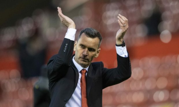 Aberdeen manager Stephen glass acknowledges the fans at Pittodrie.