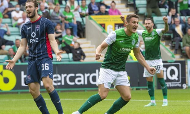 Kyle Magennis celebrates netting for Hibs against Ross County.