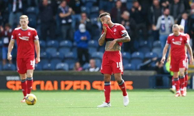 Aberdeen players look dejected after the full-time whistle at Raith Rovers.