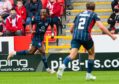 Ross County's Regan Charles-Cook celebrates after making it 1-0 against Aberdeen.