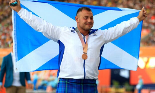 Mark Dry celebrates with his bronze medal in the men's hammer throw Final at the  2018 Commonwealth Games in the Gold Coast, Australia.