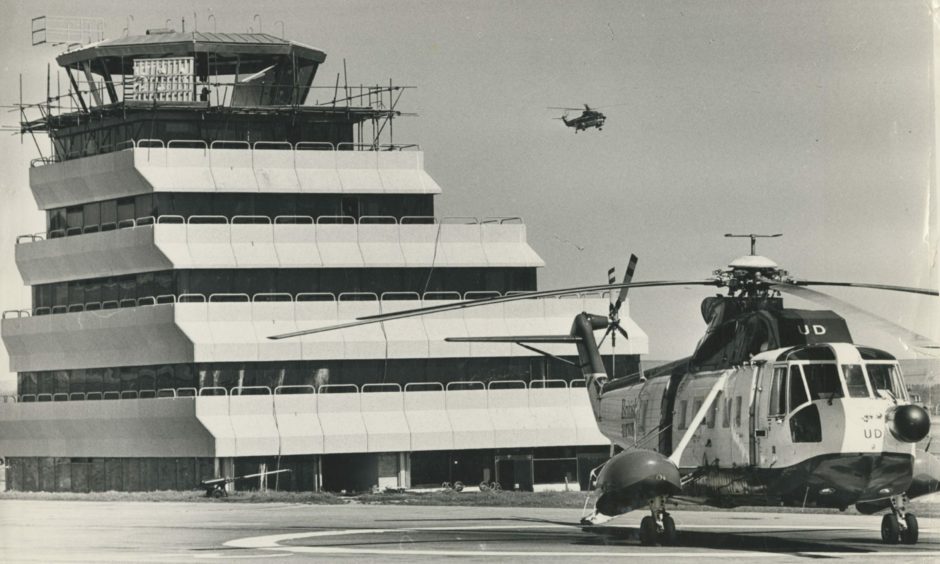 A new control tower rears over the British Airways helicopters heliport at Dyce in 1975, a stepping off point for the North Sea oil rigs and the busiest heliport in the world.