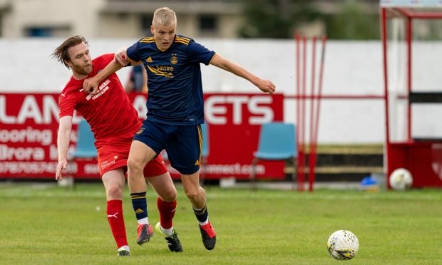 Ryan Duncan in action for Aberdeen Colts against Brora.