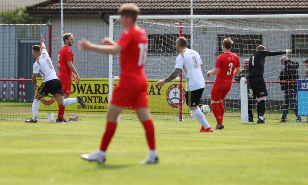 Scott Lisle opens the scoring for Formartine against Brora.