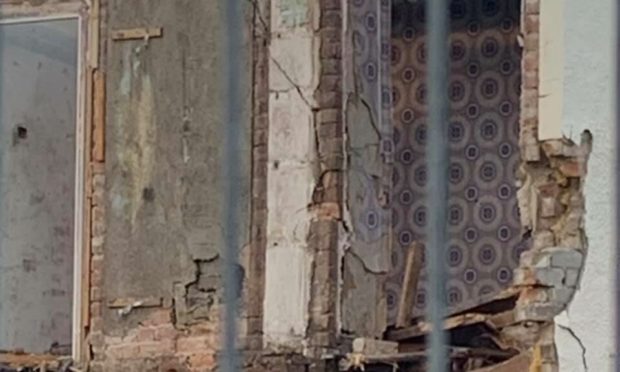 Childhood memories come flooding back when woman spots the 1970 wallpaper that once adorned her wall where her great-grandfather lived as Dingwallians mourn the loss of another piece of history in council house demolition project.