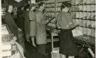 Post office workers sorting through the copious amounts of Christmas mail in 1944